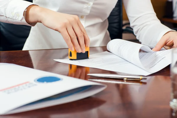 Certified notary public stamping documents